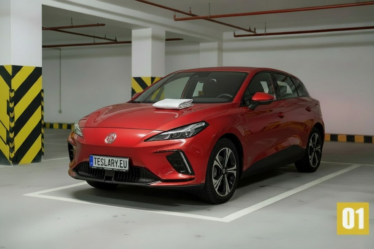 A red MG4 hatchback parked in a white parking space inside an indoor parking garage. The car features a distinctive front grille, sleek headlights, and black multi-spoke wheels.