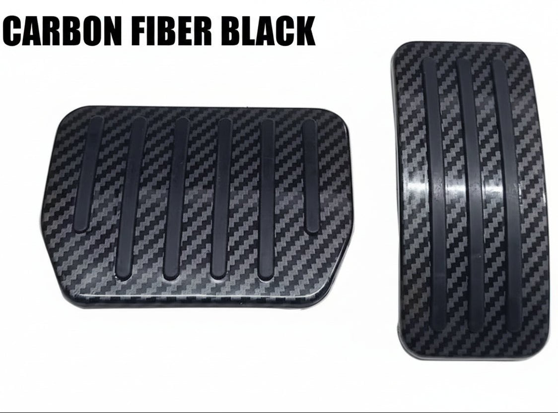 Two black carbon fiber textured pedal covers for a vehicle, shown on a plain white background.